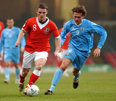 28.03.07 - Euro 2008 Qualifier Wales v San Marino Wales' Jason Koumas tries to beat Manuel Marani 