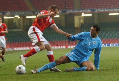 28.03.07 - Euro 2008 Qualifier Wales v San Marino Wales' Craig Bellamy tries to beat Riccardo Muccioli 