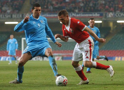 28.03.07 - Euro 2008 Qualifier Wales v San Marino Wales' Craig Bellamy tries to beat Riccardo Muccioli 