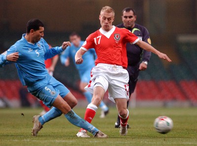 28.03.07 - Euro 2008 Qualifier Wales v San Marino Wales' David Cotterill is tackled by Riccardo Muccioli 