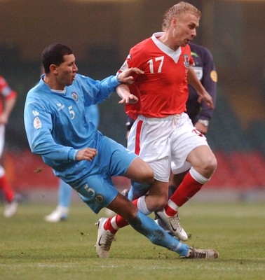28.03.07 - Euro 2008 Qualifier Wales v San Marino Wales' David Cotterill is tackled by Riccardo Muccioli 