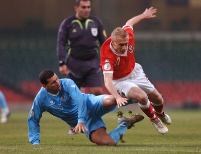 28.03.07 - Euro 2008 Qualifier Wales v San Marino Wales' David Cotterill is tackled by Riccardo Muccioli 