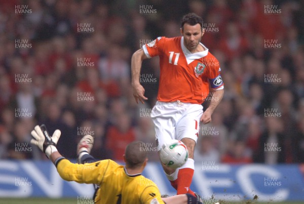 28.03.07 - Wales v San Marino - UEFA Euro 2008 Qualifying Group D - Wales' Ryan Giggs chips the ball past Aldo Simoncini to score goal 