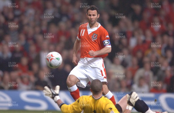 28.03.07 - Wales v San Marino - UEFA Euro 2008 Qualifying Group D - Wales' Ryan Giggs chips the ball past Aldo Simoncini to score goal 