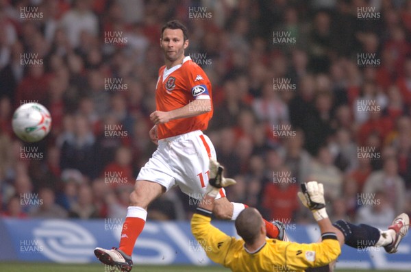 28.03.07 - Wales v San Marino - UEFA Euro 2008 Qualifying Group D - Wales' Ryan Giggs chips the ball past Aldo Simoncini to score goal 
