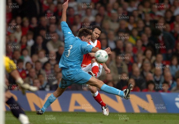 28.03.07 - Wales v San Marino - UEFA Euro 2008 Qualifying Group D - Wales' Ryan Giggs tries to shoot past Matteo Andreini 
