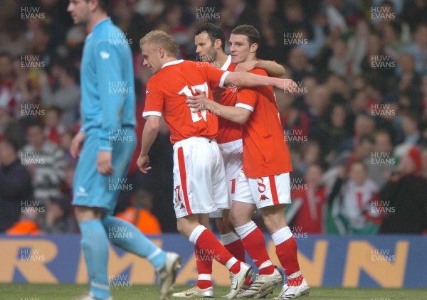 28.03.07 - Wales v San Marino - UEFA Euro 2008 Qualifying Group D - Wales' Jason Koumas celebrates scoreing from the penalty spot with Ryan Giggs(c) and  David Cotterill(L) 
