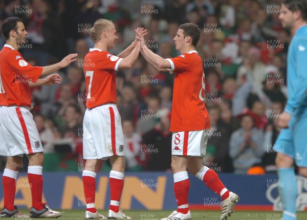 28.03.07 - Wales v San Marino - UEFA Euro 2008 Qualifying Group D - Wales' Jason Koumas celebrates scoreing from the penalty spot with Ryan Giggs(L) and  David Cotterill(C) 