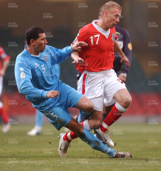 28.03.07 - Euro 2008 Qualifier Wales v San Marino Wales' David Cotterill is tackled by Riccardo Muccioli 