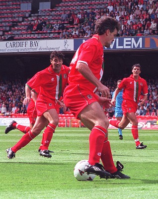 310896 - Wales v San Marino - Mark Hughes and Dean Saunders (left) of Wales in action
