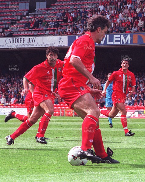 310896 - Wales v San Marino - Mark Hughes and Dean Saunders (left) of Wales in action