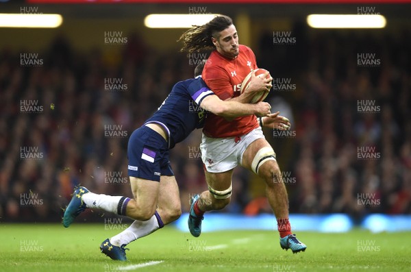 030218 - Wales v Scotland - NatWest 6 Nations 2018 - Josh Navidi of Wales is tackled by Tommy Seymour of Scotland
