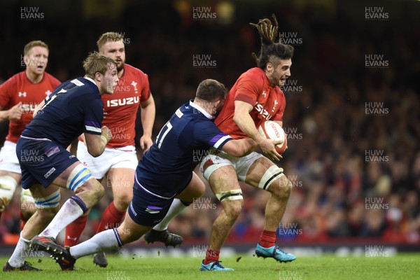 030218 - Wales v Scotland - NatWest 6 Nations 2018 - Josh Navidi of Wales is tackled by Jamie Bhatti of Scotland