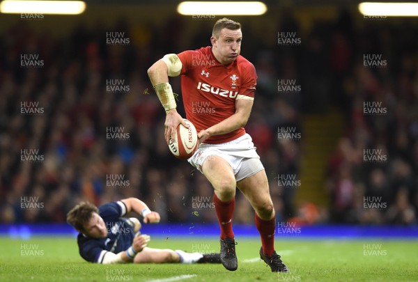 030218 - Wales v Scotland - NatWest 6 Nations 2018 - Hadleigh Parkes of Wales gets past Huw Jones of Scotland