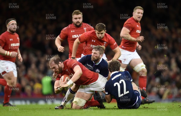 030218 - Wales v Scotland - NatWest 6 Nations 2018 - Alun Wyn Jones of Wales is tackled by John Barclay of Scotland
