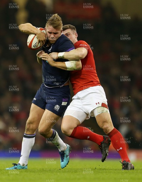 030218 - Wales v Scotland - Natwest 6 Nations - Chris Harris of Scotland is tackled by Scott Williams of Wales