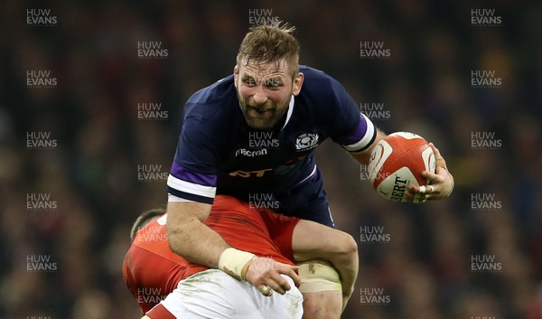 030218 - Wales v Scotland - Natwest 6 Nations - John Barclay of Scotland is tackled by Steff Evans of Wales