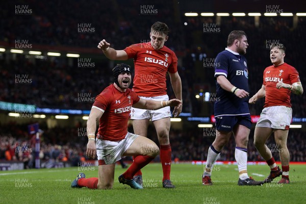 030218 - Wales v Scotland - Natwest 6 Nations - Leigh Halfpenny of Wales celebrates scoring a try with Josh Adams