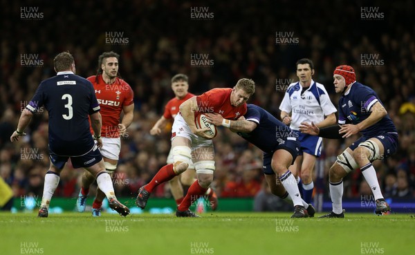 030218 - Wales v Scotland - Natwest 6 Nations - Bradley Davies of Wales is tackled by Scott Lawson of Scotland