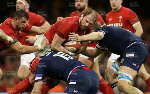 030218 - Wales v Scotland - Natwest 6 Nations - Alun Wyn Jones of Wales is tackled by Grant Gilchrist of Scotland