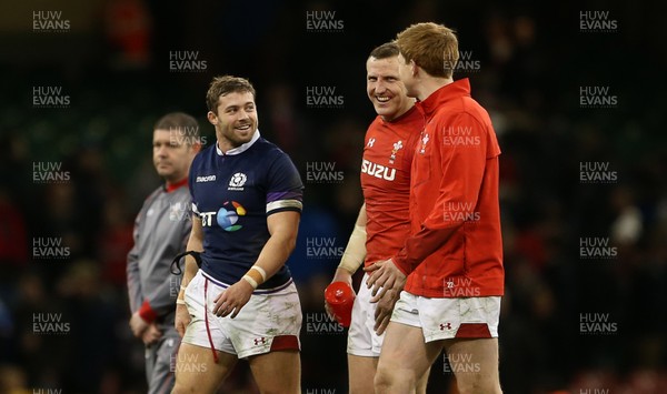 030218 - Wales v Scotland - Natwest 6 Nations - Leigh Halfpenny, Hadleigh Parkes and Rhys Patchell of Wales at full time