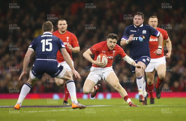 030218 - Wales v Scotland, NatWest 6 Nations - Steff Evans of Wales takes on Stuart Hogg of Scotland