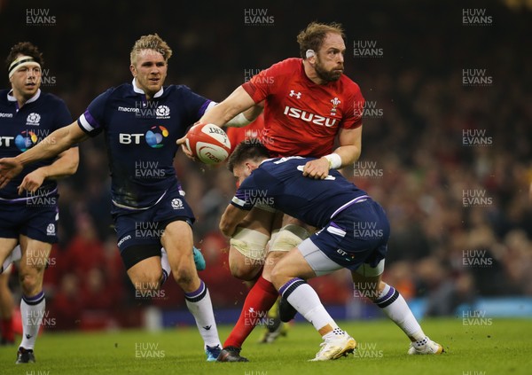 030218 - Wales v Scotland, NatWest 6 Nations - Alun Wyn Jones of Wales releases the ball as he is tackled by Ali Price of Scotland