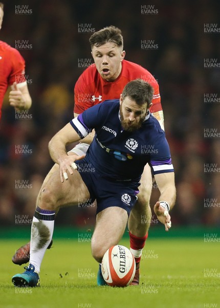 030218 - Wales v Scotland, NatWest 6 Nations - Tommy Seymour of Scotland is held by Steff Evans of Wales