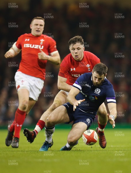 030218 - Wales v Scotland, NatWest 6 Nations - Tommy Seymour of Scotland is held by Steff Evans of Wales