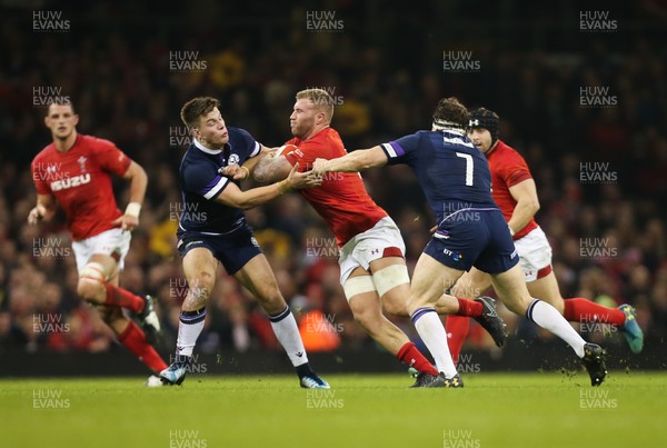 030218 - Wales v Scotland, NatWest 6 Nations - Ross Moriarty of Wales takes on Huw Jones of Scotland  and Hamish Watson of Scotland