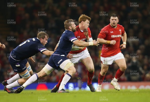 030218 - Wales v Scotland, NatWest 6 Nations - Rhys Patchell of Wales  takes on John Barclay of Scotland