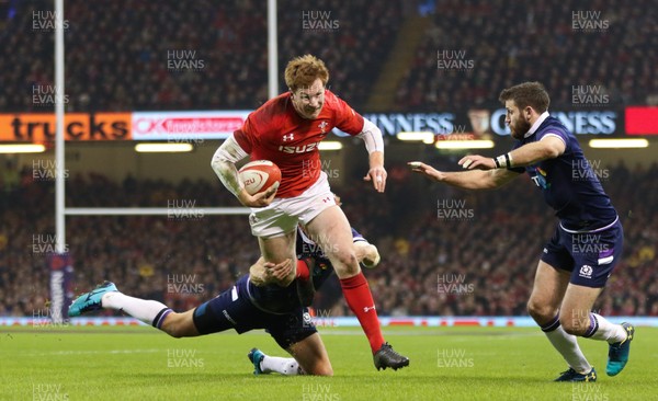 030218 - Wales v Scotland, NatWest 6 Nations - Rhys Patchell of Wales is tackled by Chris Harris of Scotland  and Tommy Seymour of Scotland