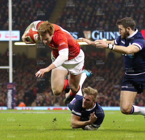 030218 - Wales v Scotland, NatWest 6 Nations - Rhys Patchell of Wales is tackled by Chris Harris of Scotland  and Tommy Seymour of Scotland