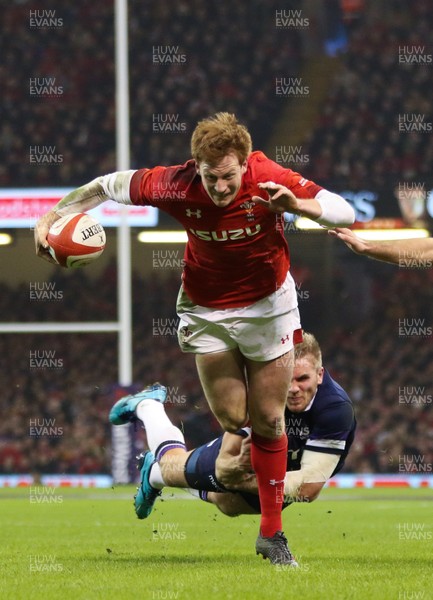 030218 - Wales v Scotland, NatWest 6 Nations - Rhys Patchell of Wales is tackled by Chris Harris of Scotland 