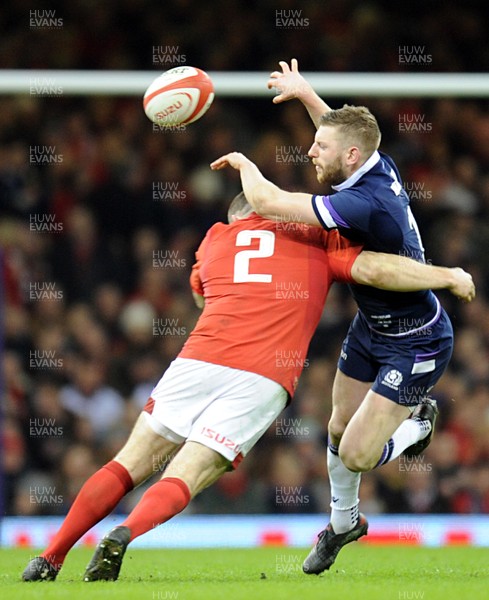 030218 - Wales v Scotland - NatWest 6 Nations - Finn Russell of Scotland is tackled by Ken Owens of Wales 
