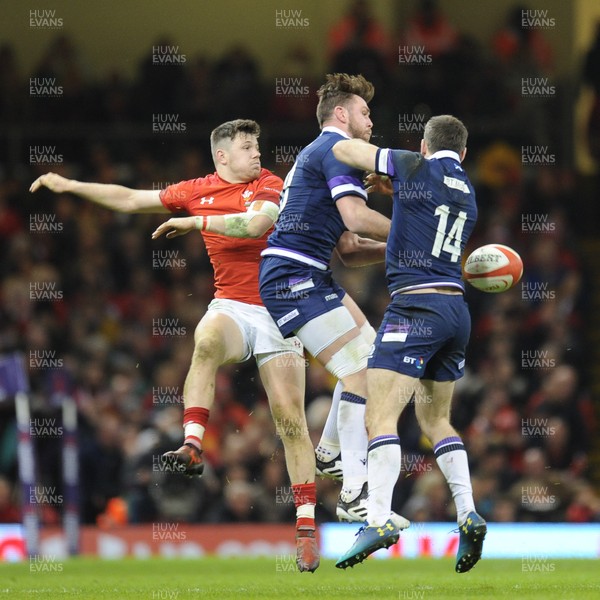 030218 - Wales v Scotland - NatWest 6 Nations - Steff Evans of Wales and Stuart Hogg of Scotland compete for the aerial ball
