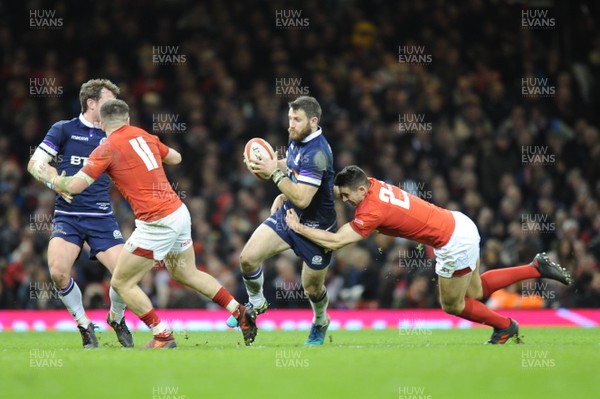 030218 - Wales v Scotland - NatWest 6 Nations - Tommy Seymour of Scotland is tackled by Owen Watkin of Wales 