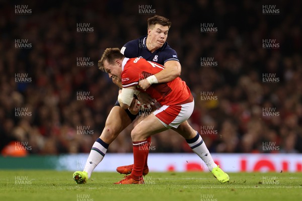 030224 - Wales v Scotland - Guinness 6 Nations 2024 - Nick Tompkins of Wales is tackled by Kyle Steyn of Scotland 