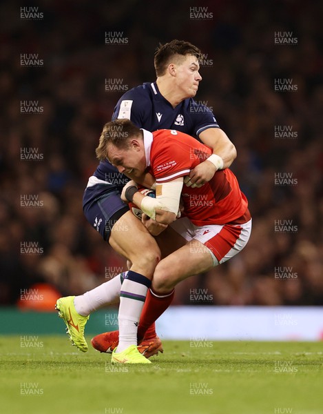 030224 - Wales v Scotland - Guinness 6 Nations 2024 - Nick Tompkins of Wales is tackled by Kyle Steyn of Scotland 