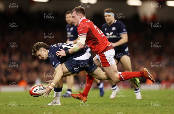 030224 - Wales v Scotland - Guinness 6 Nations 2024 - Kyle Rowe of Scotland is challenged by Nick Tompkins of Wales 