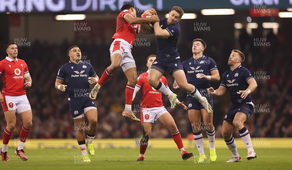 030224 - Wales v Scotland, Guinness Six Nations 2024 - Kyle Rowe of Scotland and Rio Dyer of Wales compete for the ball