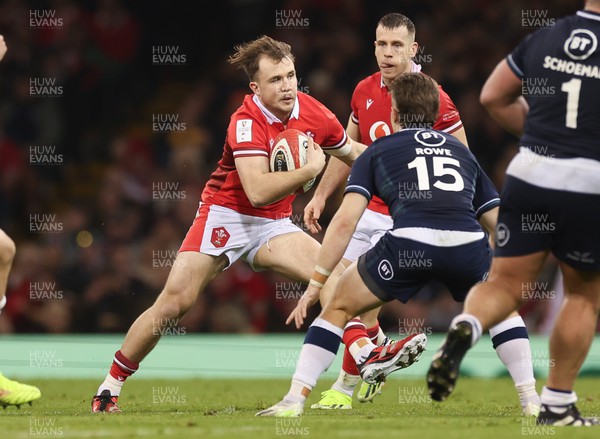 030224 - Wales v Scotland, Guinness Six Nations 2024 - Ioan Lloyd of Wales takes on Kyle Rowe of Scotland
