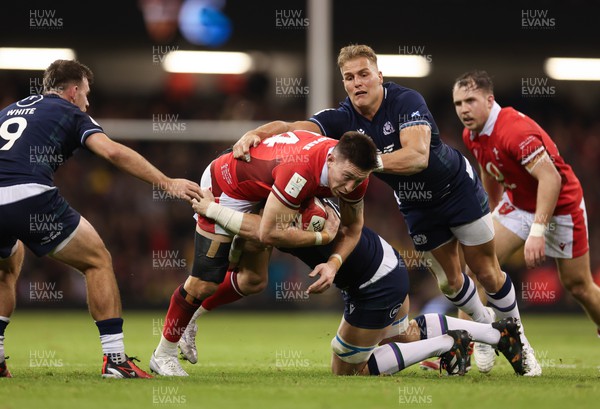 030224 - Wales v Scotland, Guinness Six Nations 2024 - Josh Adams of Wales  is tackled