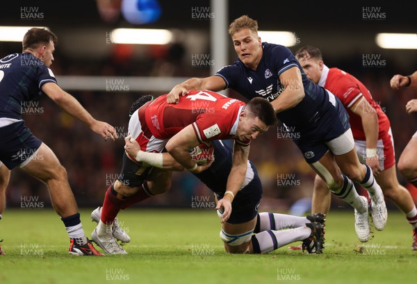 030224 - Wales v Scotland, Guinness Six Nations 2024 - Josh Adams of Wales  is tackled