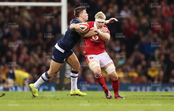 030224 - Wales v Scotland, Guinness Six Nations 2024 - Aaron Wainwright of Wales  takes on Huw Jones of Scotland
