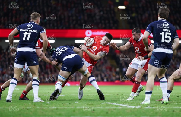 030224 - Wales v Scotland, Guinness Six Nations 2024 - Josh Adams of Wales is tackled by Jack Dempsey of Scotland