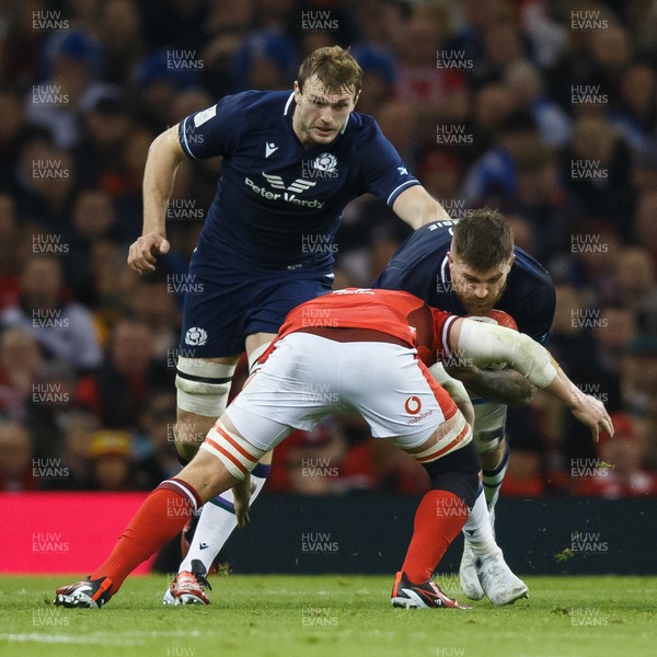 030224 - Wales v Scotland - Guinness Six Nations - Luke Crosbie of Scotland is tackled by James Botham of Wales