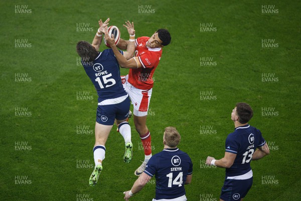 030224 - Wales v Scotland - Guinness Six Nations - Kyle Rowe of Scotland and Rio Dyer of Wales go up for a high ball