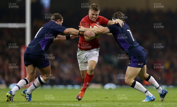 031118 - Wales v Scotland - Under Armour Series - Gareth Anscombe of Wales is tackled by Allan Dell and Hamish Watson of Scotland