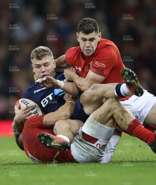 031118 - Wales v Scotland - Under Armour Series - Darcy Graham of Scotland is tackled by Luke Morgan and Tomos Williams of Wales